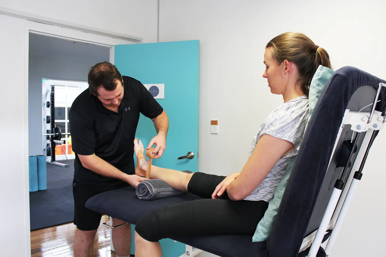 Physiotherapist treating a patient at Physio Impact, Eden Terrace